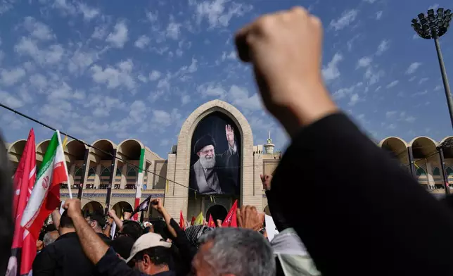 Mourners attend the start of the dayslong funeral ceremonies for slain Iranian Supreme Leader Ayatollah Ali Khamenei and members of his family at the Imam Khomeini Mosalla Grand Mosque in Tehran, Iran, Saturday, July 4, 2026. (AP Photo/Altaf Qadri)