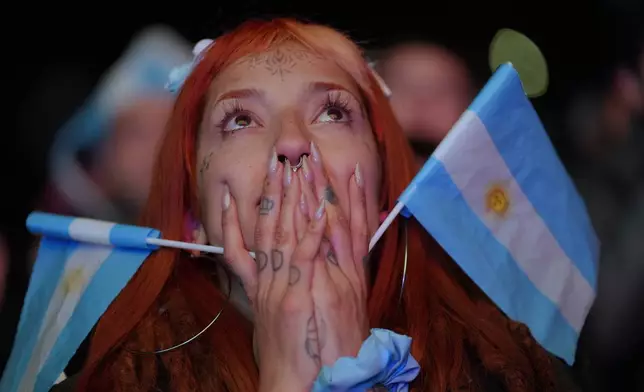 A fan watches the World Cup round of 32 soccer match between Argentina and Cape Verde in Buenos Aires, Argentina, Friday, July 3, 2026. (AP Photo/Rodrigo Abd)