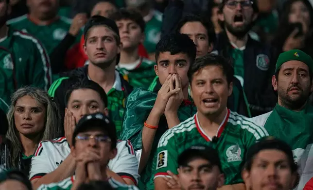 Mexico fans react during the World Cup round of 16 soccer match between Mexico and England in Mexico City, Sunday, July 5, 2026. (AP Photo/Ricardo Mazalan)