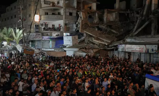 Palestinians watch a live broadcast of the World Cup round of 32 soccer match between Egypt and Australia in Nuseirat, central Gaza Strip, Friday, July 3, 2026. (AP Photo/Abdel Kareem Hana)