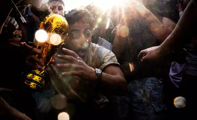Fans celebrate after Spain beat Argentina in the World Cup final soccer match, Sunday, July 19, 2026, at the FIFA Fan Zone on the National Mall in Washington. (AP Photo/Julia Demaree Nikhinson)