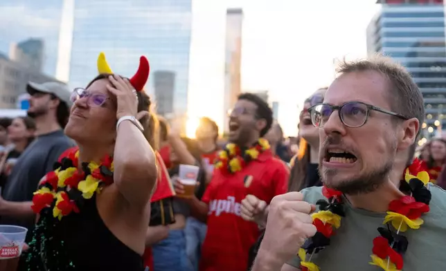 Belgium fans watch the quarterfinal World Cup soccer match between Belgium and Spain, in Brussels, Friday, July 10, 2026. (AP Photo/Marius Burgelman)