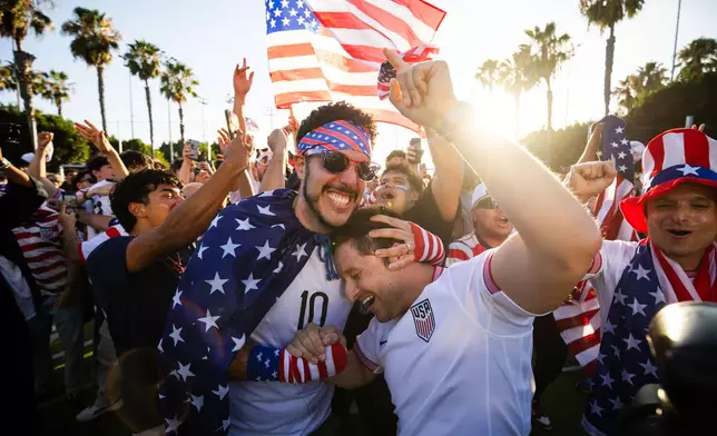 Fans react after the U.S. defeated Bosnia during a watch party for a World Cup Round of 32 soccer match between the United States and Bosnia in Carson, Calif., Wednesday, July 1, 2026. (AP Photo/Ethan Swope)