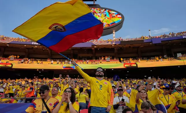Colombia soccer fans cheer from the stands ahead the World Cup round of 32 soccer match between Colombia and Ghana in Kansas City, Mo., Friday, July 3, 2026. (AP Photo/John Locher)