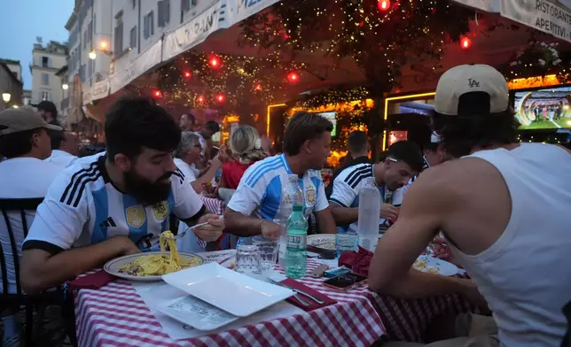 Argentina supporters gather to follow their national team playing against Spain in the 2026 Soccer World Cup final being played in New York, in Rome, Sunday, July 19, 2026.(AP Photo/Andrew Medichini)