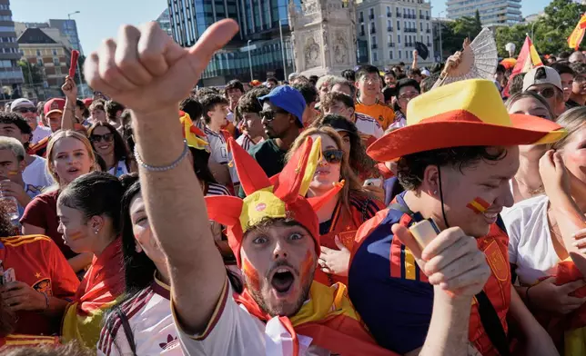 Spanish fans gather in central Madrid ahead of the World Cup final soccer match between Spain and Argentina in East Rutherford, N.J., near New York, Sunday, July 19, 2026. (AP Photo/Bernat Armangue)