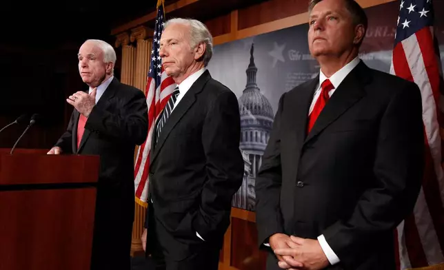 FILE - Senate Armed Services Committee members, from left, Sen. John McCain, R-Ariz., the committee's ranking Republican, Sen. Joseph Lieberman, I-Conn., and Sen. Lindsey Graham, R-S.C., take part in a news conference on Capitol Hill in Washington, June 23, 2010. (AP Photo/Alex Brandon, File)