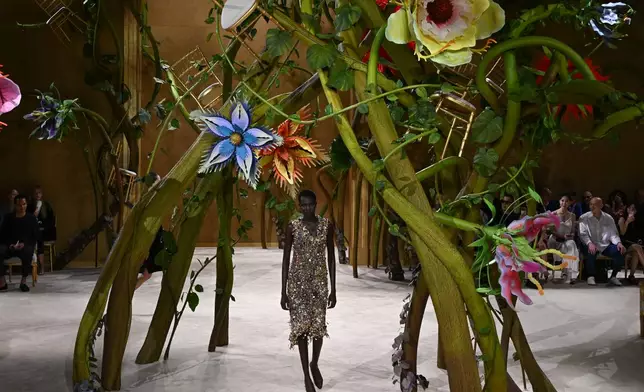 A model wears a creation as part of the Chanel Haute Couture Fall/Winter 2026-2027 Women's collection presented in Paris, Tuesday, July 7, 2026. (AP Photo/Emma Da Silva)