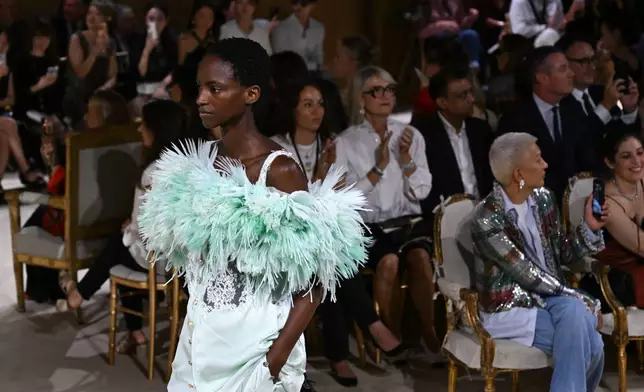 A model wears a creation as part of the Chanel Haute Couture Fall/Winter 2026-2027 Women's collection presented in Paris, Tuesday, July 7, 2026. (AP Photo/Emma Da Silva)
