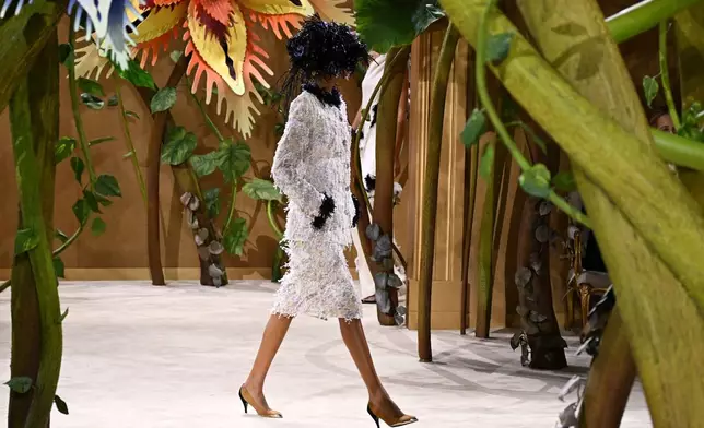 A model wears a creation as part of the Chanel Haute Couture Fall/Winter 2026-2027 Women's collection presented in Paris, Tuesday, July 7, 2026. (AP Photo/Emma Da Silva)