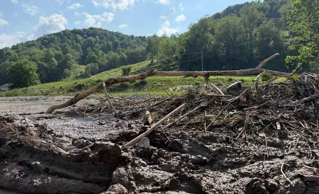 Mud and debris near Stonecoal Creek in Horner, W.Va., after severe floods on Wednesday, July 22, 2026. (AP Photo/Patrick Aftoora-Orsagos)