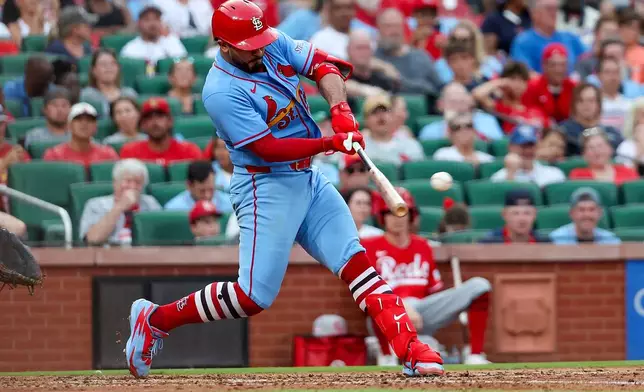 St. Louis Cardinals' Iván Herrera hits a two-RBI double during the sixth inning of a baseball game against the Cincinnati Reds Saturday, July 25, 2026, in St. Louis. (AP Photo/Scott Kane)