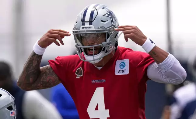 Dallas Cowboys quarterback Dak Prescott yells instructions during the NFL football team's training camp, Wednesday, July 29, 2026, in Oxnard, Calif. (AP Photo/Mark J. Terrill)
