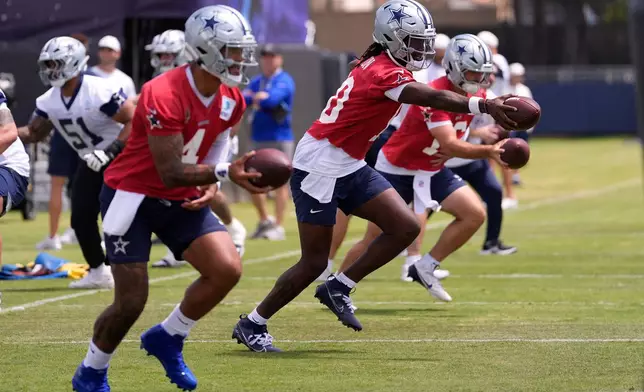 Dallas Cowboys, from left, quarterback Dak Prescott, quarterback Joe Milton III and quarterback Sam Howell run a drill during the NFL football team's training camp, Wednesday, July 29, 2026, in Oxnard, Calif. (AP Photo/Mark J. Terrill)