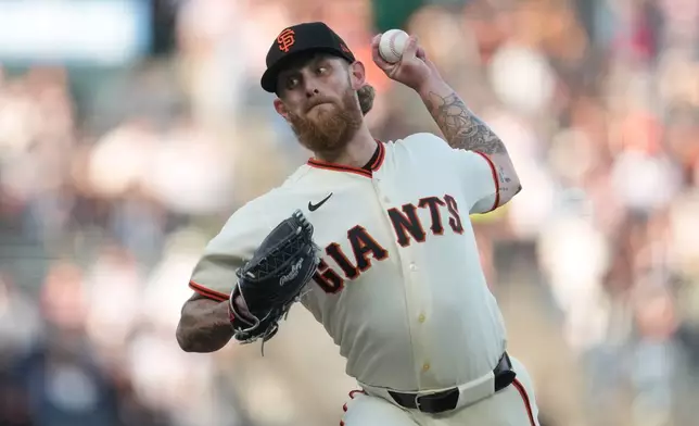 San Francisco Giants pitcher Carson Whisenhunt throws against the Colorado Rockies during the first inning of a baseball game Thursday, July 9, 2026, in San Francisco. (AP Photo/Jeff Chiu)