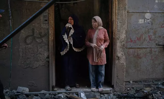 Residents inspect the site of an Israeli airstrike in Gaza city, Saturday, July 18, 2026. (AP Photo/Jehad Alshrafi)