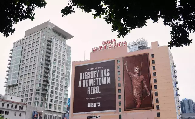 A billboard featuring U.S. soccer player Christian Pulisic is pictured on the side of the Hotel Figueroa, Monday, June 29, 2026, in Los Angeles. (AP Photo/Chris Pizzello)