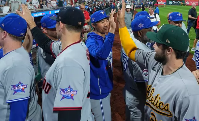 American League players celebrate after they beat the National League in the MLB baseball All-Star Game, Tuesday, July 14, 2026, in Philadelphia. (AP Photo/Matt Rourke)