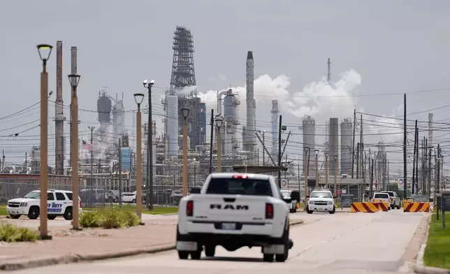 FILE- A truck enters the Exxon Mobil Baytown Olefins Plant, Wednesday, April 29, 2026, in Baytown, Texas. (AP Photo/Ashley Landis, File)