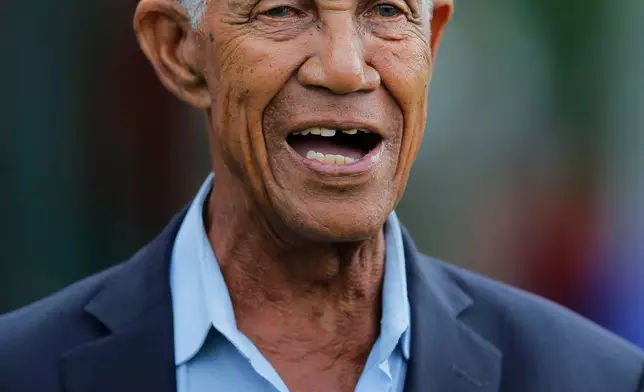 FILE - West Indies cricket great Garfield Sobers, reacts as he watches West Indies team members during a training session ahead of their second test cricket match against Sri Lanka in Colombo, Sri Lanka, Oct. 21, 2015. (AP Photo/Eranga Jayawardena)