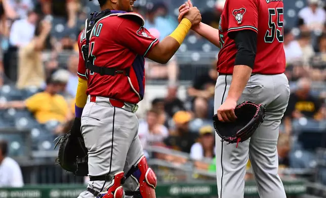 Arizona Diamondbacks pitcher Brandyn Garcia (55) celebrates with catcher Gabriel Moreno, left, after getting the final out of a baseball game against the Pittsburgh Pirates in Pittsburgh, Wednesday, July 29, 2026. (AP Photo/Justin Berl)