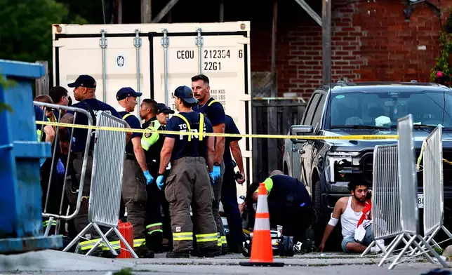 Paramedics respond to an active shooter at the Salsa on St. Clair event in Toronto, Saturday, July 11, 2026. (Keito Newman/The Canadian Press via AP)