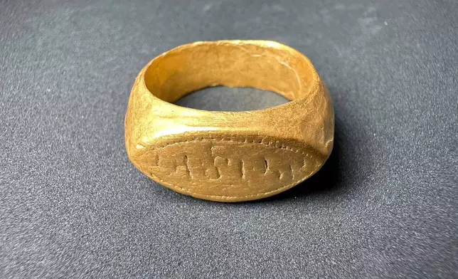 This photo released by The Fine Arts Department, shows a gold ring at the Don Yai Thong archeological site in Phetchaburi province, Thailand, Thursday, July 2, 2026. (The Fine Arts Department via AP)