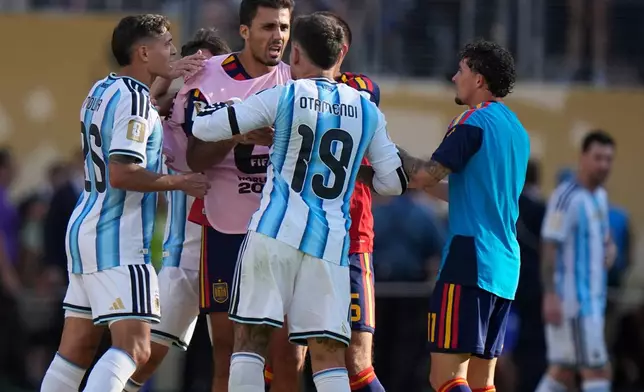 Argentina's Nicolas Otamendi (19) and Nahuel Molina (26) scuffle with Spain’s Rodri (16) after the World Cup final soccer match between Spain and Argentina in East Rutherford, N.J., near New York, Sunday, July 19, 2026. (AP Photo/Frank Franklin II)