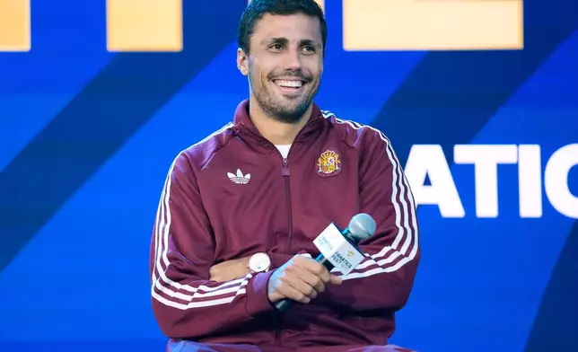 Spain's Rodri smiles during a news conference ahead of the World Cup final soccer match between Spain and Argentina in New York, Friday, July 17, 2026. (AP Photo/Frank Franklin II)