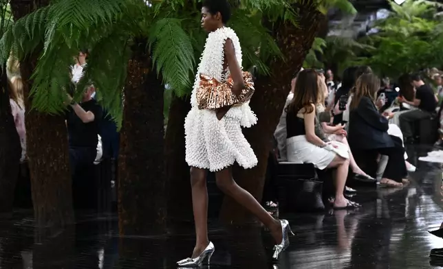 Models wear creations as part of the Christian Dior Haute Couture Fall/Winter 2026-2027 Women's collection presented in Paris, Monday, July 6, 2026. (AP Photo/Emma Da Silva)