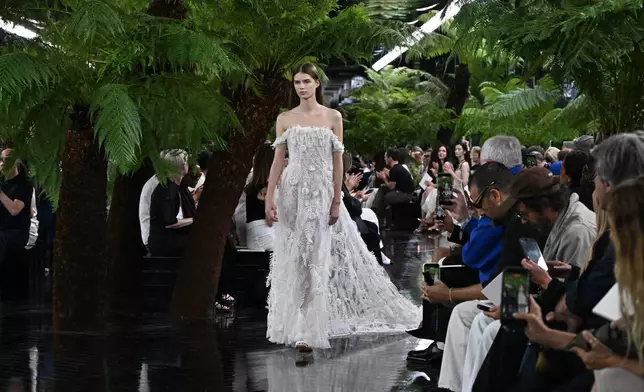 A model wears a creation as part of the Christian Dior Haute Couture Fall/Winter 2026-2027 Women's collection presented in Paris, Monday, July 6, 2026. (AP Photo/Emma Da Silva)