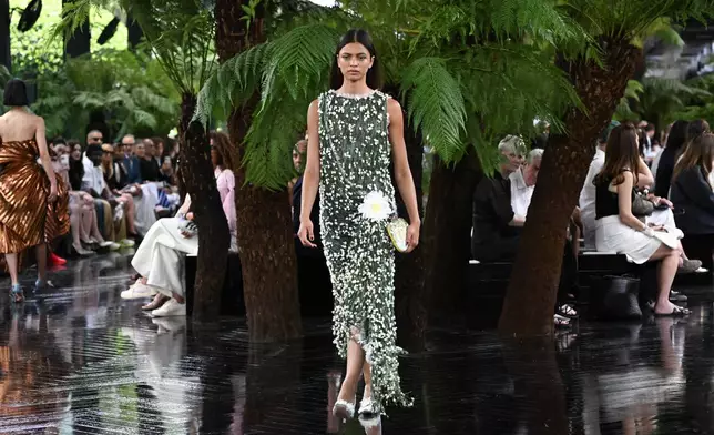 A model wears a creation as part of the Christian Dior Haute Couture Fall/Winter 2026-2027 Women's collection presented in Paris, Monday, July 6, 2026. (AP Photo/Emma Da Silva)