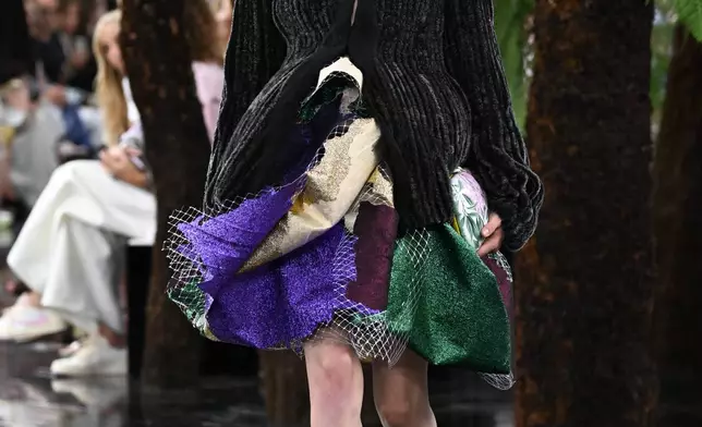 A model wears a creation as part of the Christian Dior Haute Couture Fall/Winter 2026-2027 Women's collection presented in Paris, Monday, July 6, 2026. (AP Photo/Emma Da Silva)