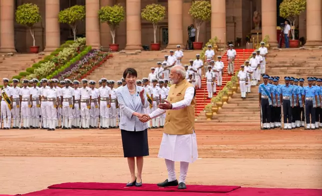 Indian Prime Minister Narendra Modi, right, shakes hand with his Japanese counterpart Sanae Takaichi during her ceremonial reception at the Indian presidential palace in New Delhi, India, Thursday, July 2, 2026. (AP Photo/Manish Swarup)