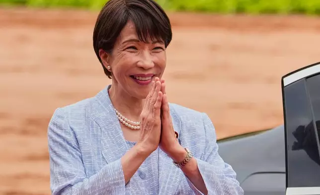 Japanese Prime Minister Sanae Takaichi greets Indian Prime Minister Narendra Modi, unseen, upon her arrival for a ceremonial reception at the Presidential Palace in New Delhi, India, Thursday, July 2, 2026. (AP Photo/Manish Swarup)