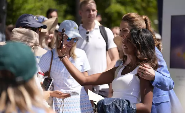 Britain's Kate, the Princess of Wales poses for a selfie with a fan, during a visit on day four of the Wimbledon Tennis Championships in London, Thursday, July 2, 2026. (AP Photo/Andrew Matthews)