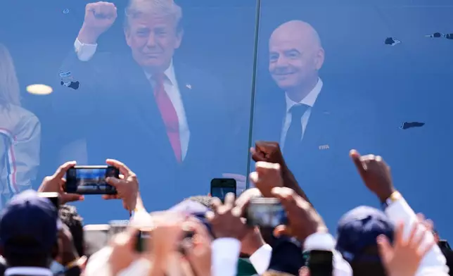 President Donald J. Trump stands with FIFA President Gianni Infantino before the World Cup final soccer match between Spain and Argentina in East Rutherford, N.J., near New York, Sunday, July 19, 2026. (AP Photo/Julio Cortez)