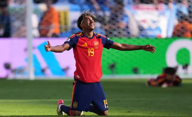 Spain's Lamine Yamal (19) celebrates after the team's win during the World Cup final soccer match between Spain and Argentina in East Rutherford, N.J., near New York, Sunday, July 19, 2026. (AP Photo/Abbie Parr)