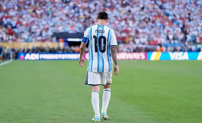 Argentina's Lionel Messi walks on the pitch during the World Cup final soccer match between Spain and Argentina in East Rutherford, N.J., near New York, Sunday, July 19, 2026. (AP Photo/Ashley Landis)