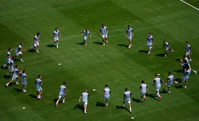Argentina warms up prior to the World Cup final soccer match between Spain and Argentina in East Rutherford, N.J., near New York, Sunday, July 19, 2026. (AP Photo/Yuki Iwamura)