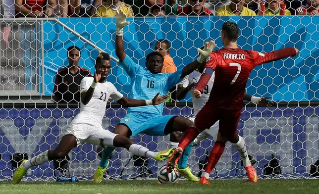 FILE - Portugal's Cristiano Ronaldo scores his team's second goal against Ghana during the group G World Cup soccer match in Brasilia, Brazil, June 26, 2014. (AP Photo/Martin Mejia, File)