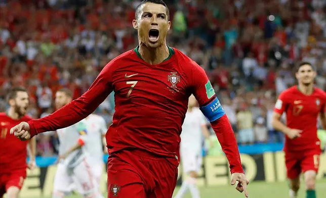 FILE - Portugal's Cristiano Ronaldo celebrates his side's opening goal against Spain during the group B match at the World Cup in Sochi, Russia, June 15, 2018. (AP Photo/Francisco Seco, File)