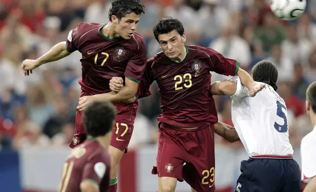 FILE - Portugal's Cristiano Ronaldo, left, and Helder Postiga jump for the ball against England's Rio Ferdinand during a World Cup quarterfinal soccer match in Gelsenkirchen, Germany, July 1, 2006. (AP Photo/Martin Meissner, File)