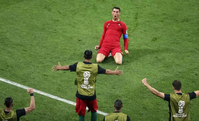 FILE - Portugal's Cristiano Ronaldo celebrates scoring his team's second goal at the World Cup group B soccer match against Spain in Sochi, Russia, June 15, 2018. (AP Photo/Thanassis Stavrakis, File)