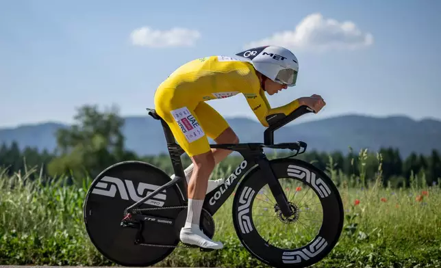 Tadej Pogacar from Slovenia pedals during the fourth stage, a 23,8 km time trial race with start and finish in Aarburg, at the 89th Tour de Suisse UCI World Tour cycling race, Saturday, June 20, 2026. (Gian Ehrenzeller/Keystone via AP)