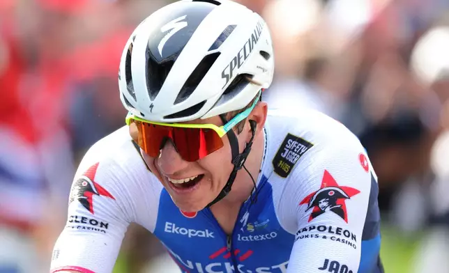 FILE - Belgium's Remco Evenepoel reacts as he crosses the finish line to win the Belgian cycling classic and UCI World Tour cycling race Liege Bastogne Liege, in Liege, Belgium, on April 24, 2022. (AP Photo/Olivier Matthys, File)