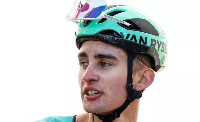 FILE - Paul Seixas of France catches his breath after crossing the finish line to win the Belgian cycling classic Fleche Wallonne (Walloon Arrow), in Huy, Belgium, on April 22, 2026. (AP Photo/Geert Vanden Wijngaert, File)
