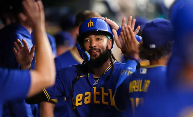 Seattle Mariners' J.P. Crawford celebrates after scoring in the sixth inning of a baseball game against the Los Angeles Angels, Thursday, July 2, 2026, in Seattle. (AP Photo/Kevin Ng)
