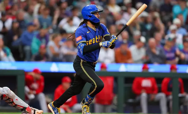 Seattle Mariners' J.P. Crawford doubles in the sixth inning of a baseball game against the Los Angeles Angels, Thursday, July 2, 2026, in Seattle. (AP Photo/Kevin Ng)
