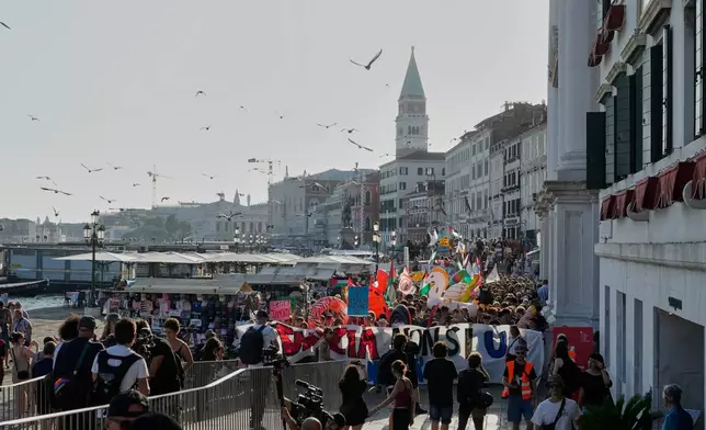 Demonstrators gather to protest against U.S. Ambassador Tilman Fertitta's luxury yacht 'Boardwalk" presence in Venice, Friday, July 17, 2026. (AP Photo/Luca Bruno)